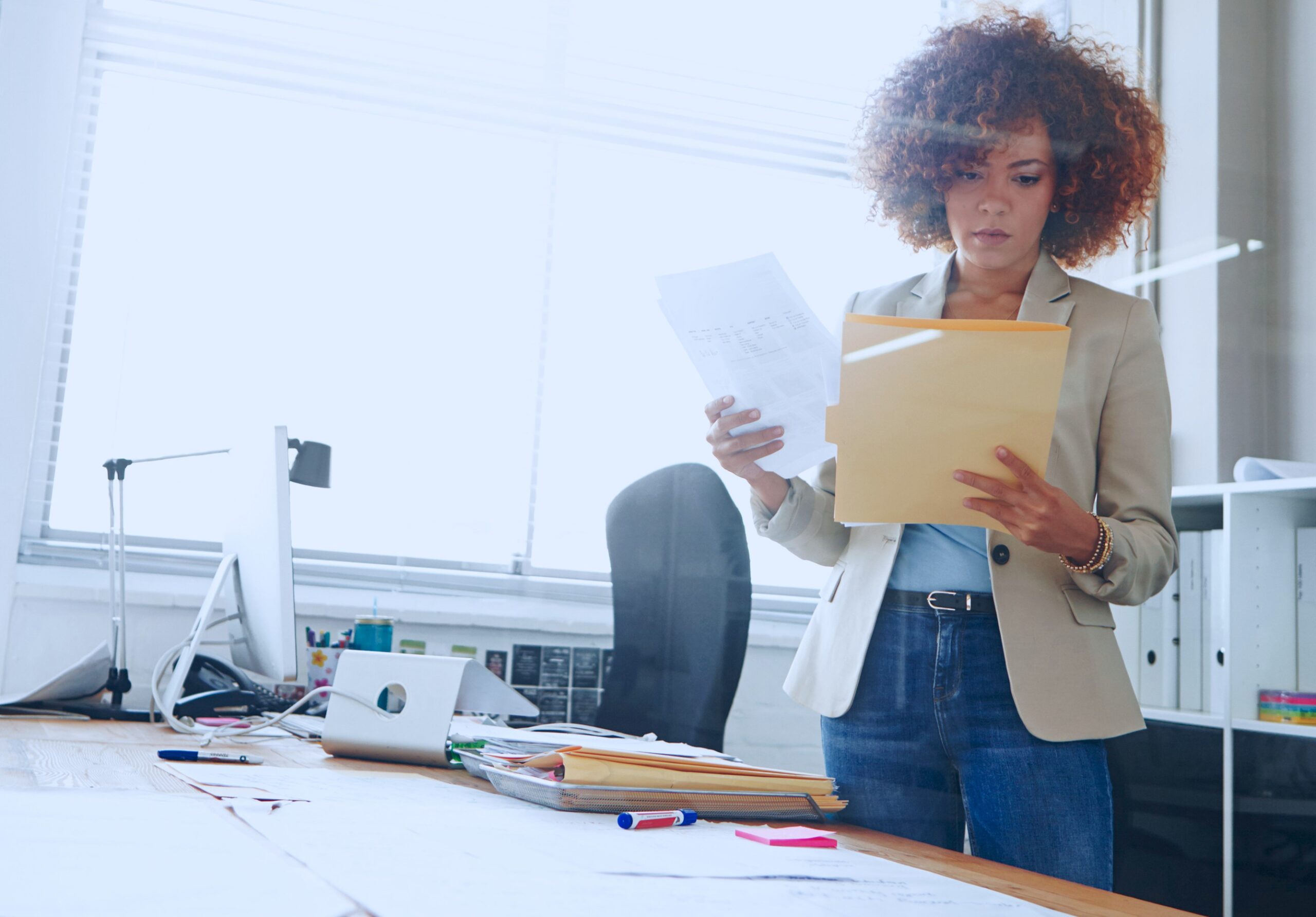 Finance professional reviewing documents in an office