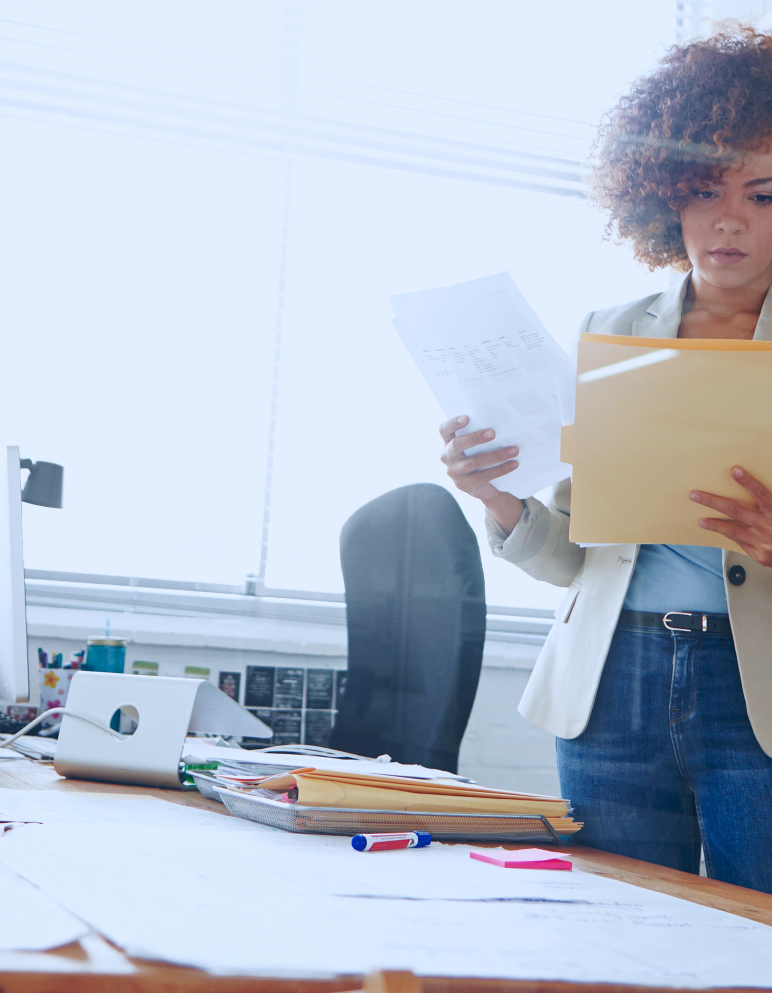 Finance professional reviewing documents in an office